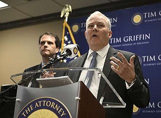 Arkansas Attorney General Tim Griffin, right, stands and Arkansas Solicitor General Nicholas Bronni answers questions from the media regarding a lawsuit for the eastern district on behalf of four other states against the U.S. department of education over its new rule interpreting Title IX during a press conference in Little Rock on Tuesday, May 7, 2024. (Arkansas Democrat-Gazette/Stephen Swofford)